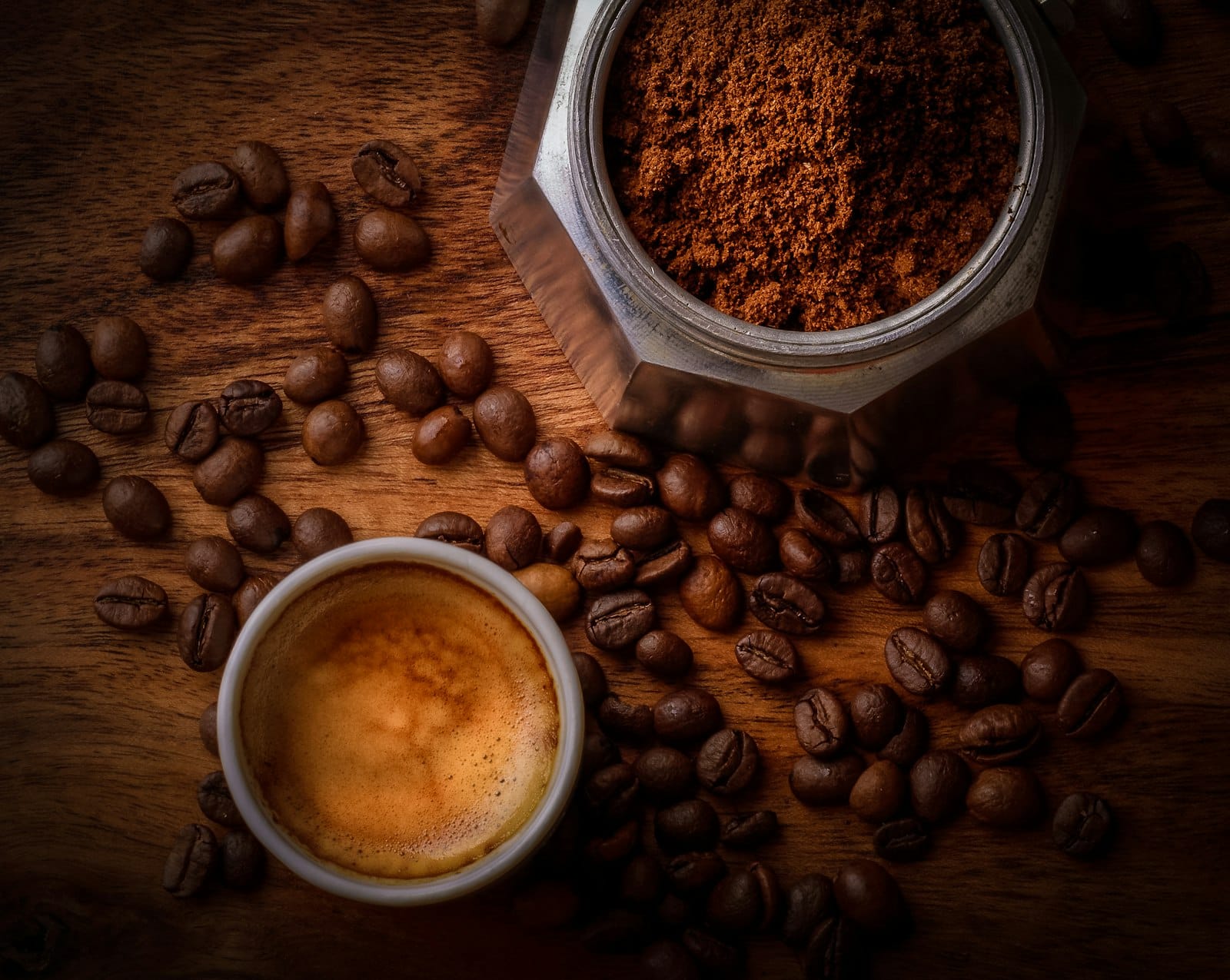 Overhead flat lay of coffee cups and beans